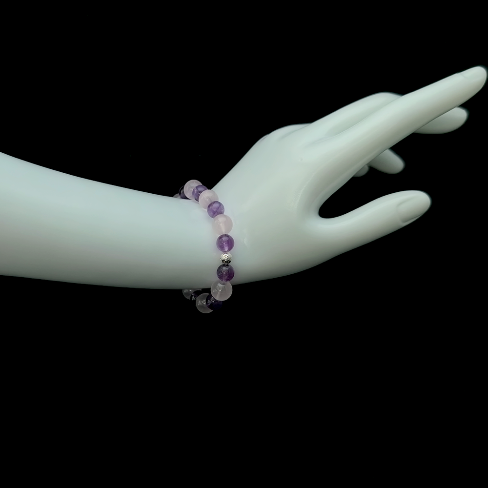 Rose Quartz and Amethyst bracelet worn on hand for emotional softness, heart opening, and healing perfectionism-driven emotional control – JING Balance