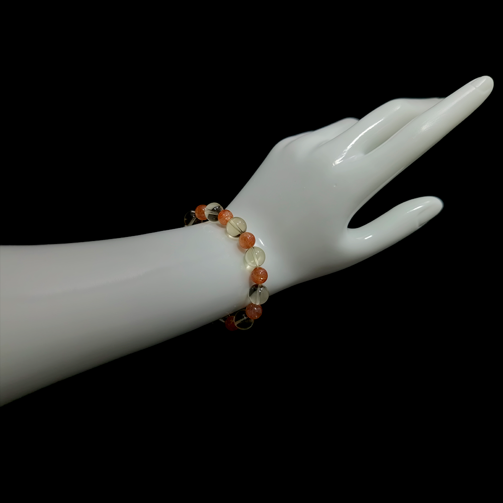 Citrine and Sunstone bracelet worn on hand showing radiant energy and gentle vitality