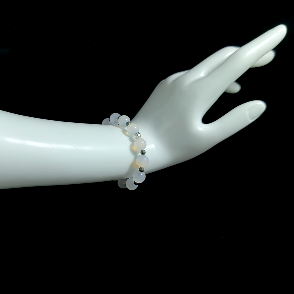 White Agate and Pyrite bracelet worn on hand for easing comparison anxiety and supporting inner security and emotional steadiness – JING Balance