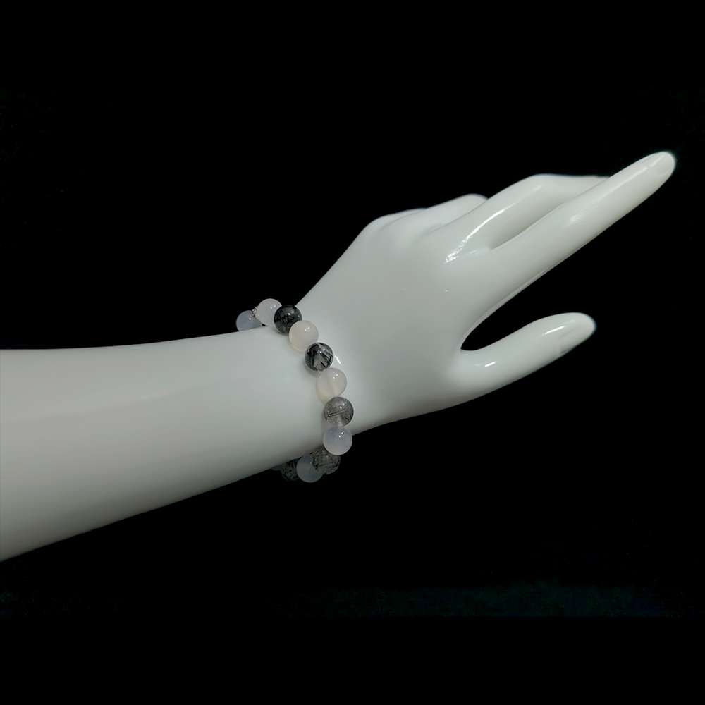 White Agate and Black Rutilated Quartz bracelet worn on hand showing clarity, calm, and grounded energy