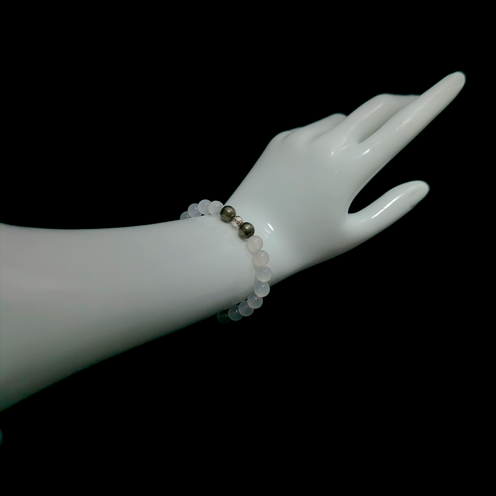 Pyrite and White Agate bracelet worn on hand showing calm confidence and protective grounding energy
