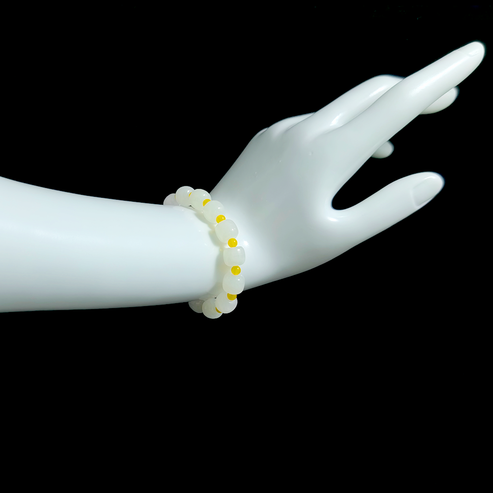 Steady Presence white Hetian jade and yellow agate bracelet worn on wrist