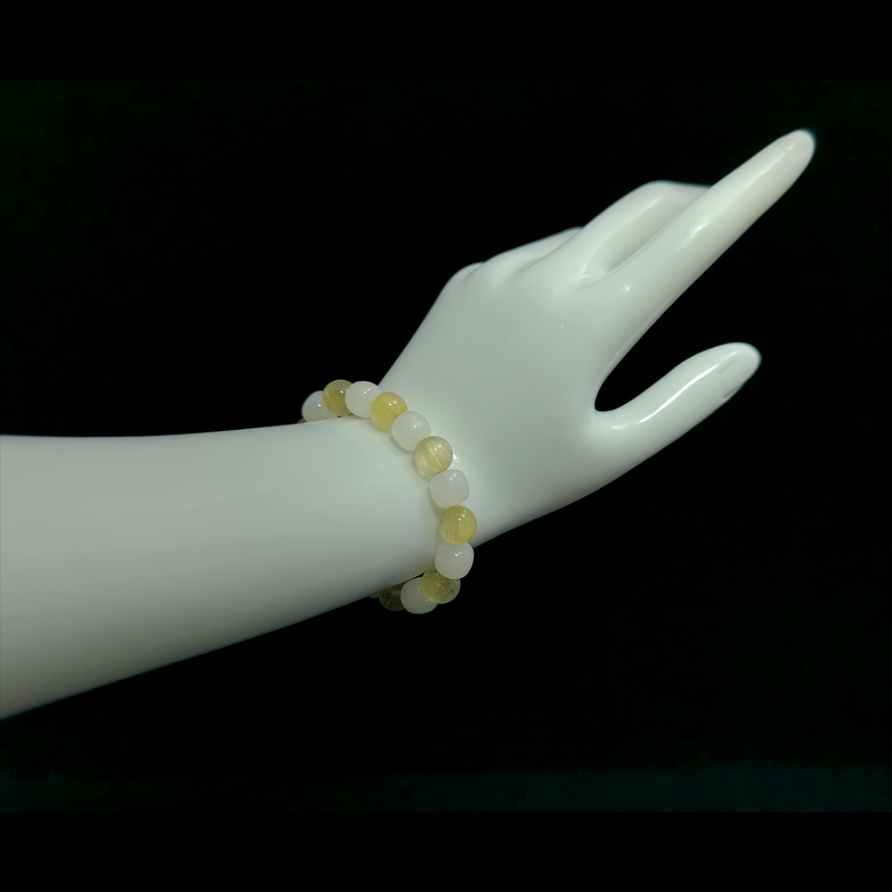 White Hetian Jade and Golden Rutilated Quartz bracelet worn on hand showing calm confidence and inner harmony