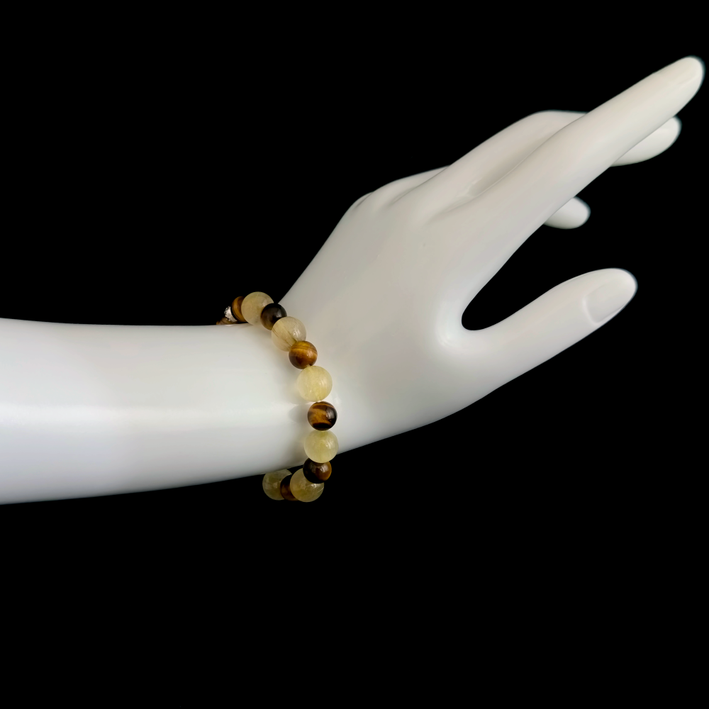 Golden Rutilated Quartz and Tiger’s Eye bracelet worn on hand showing grounded progress and a stronger sense that results actually count