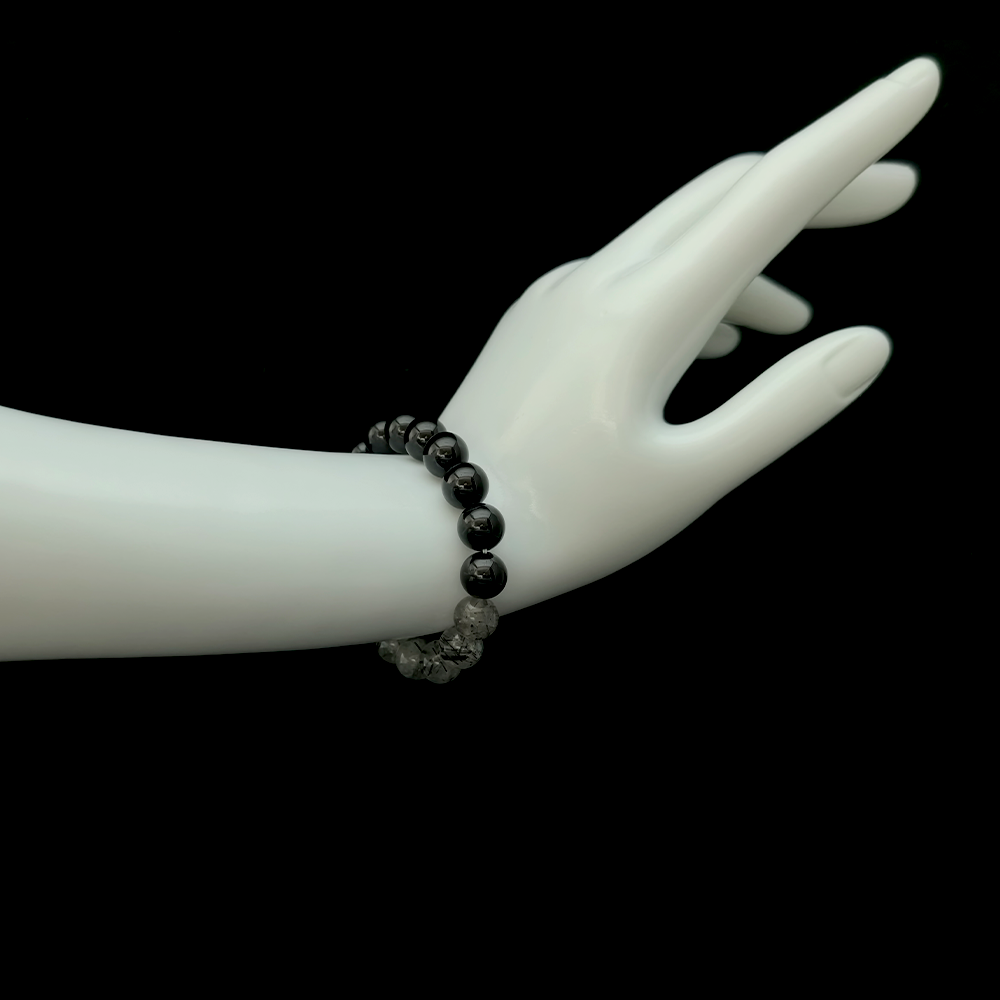 Black Tourmaline and Black Rutilated Quartz bracelet worn on hand for burnout healing, emotional release, and restoring inner lightness – JING Balance