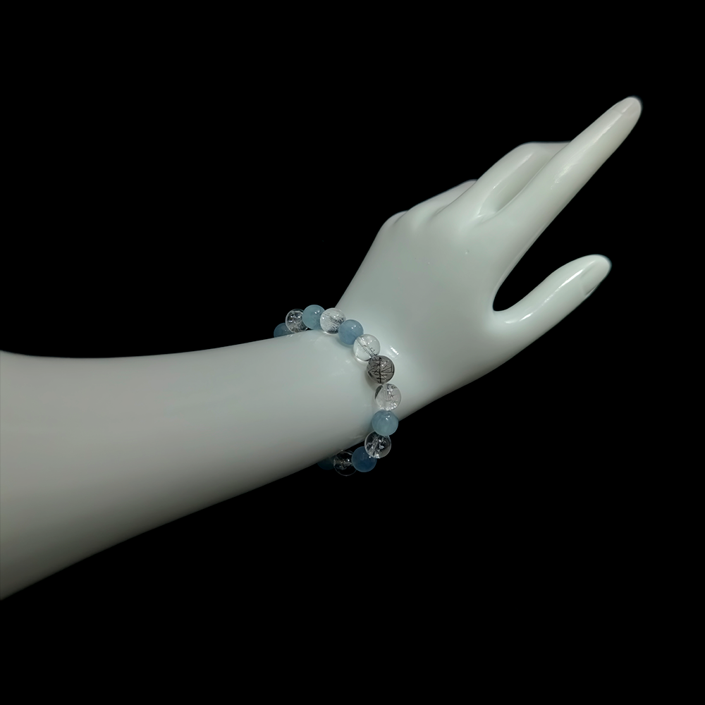 Aquamarine and Clear Quartz confidence bracelet worn on hand showing elegant water-element energy jewelry