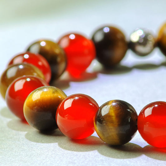 Close-up of Red Agate and Tiger’s Eye beads in a crystal bracelet for stronger action drive