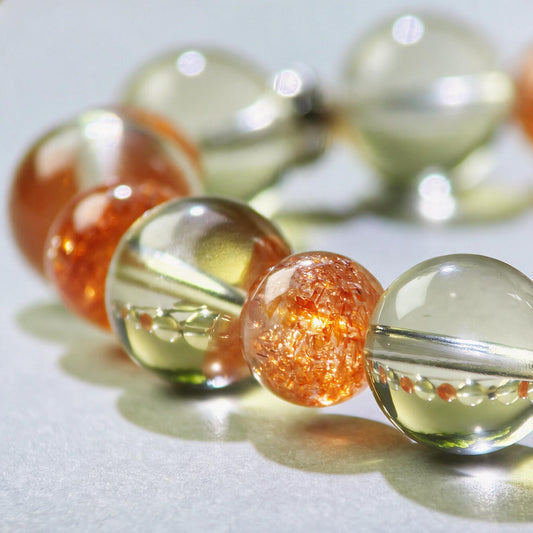 Close-up of Citrine and Golden Sunstone beads in a crystal bracelet for clearer decisions and earlier action