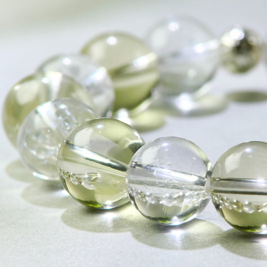 Close-up of Citrine and Himalayan Clear Quartz beads in a crystal bracelet for clearer access to thoughts
