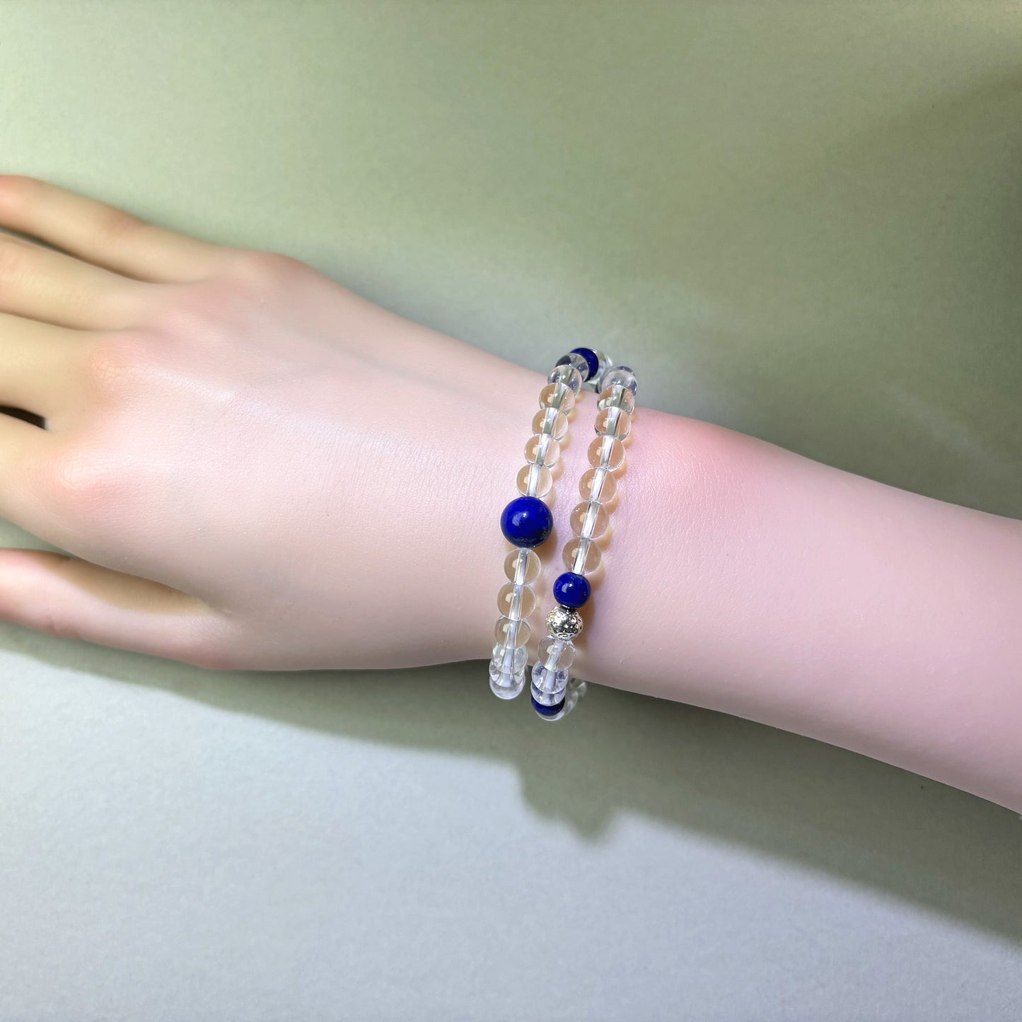 Clear Quartz and Lapis Lazuli bracelet worn on wrist for clear action and less hesitation