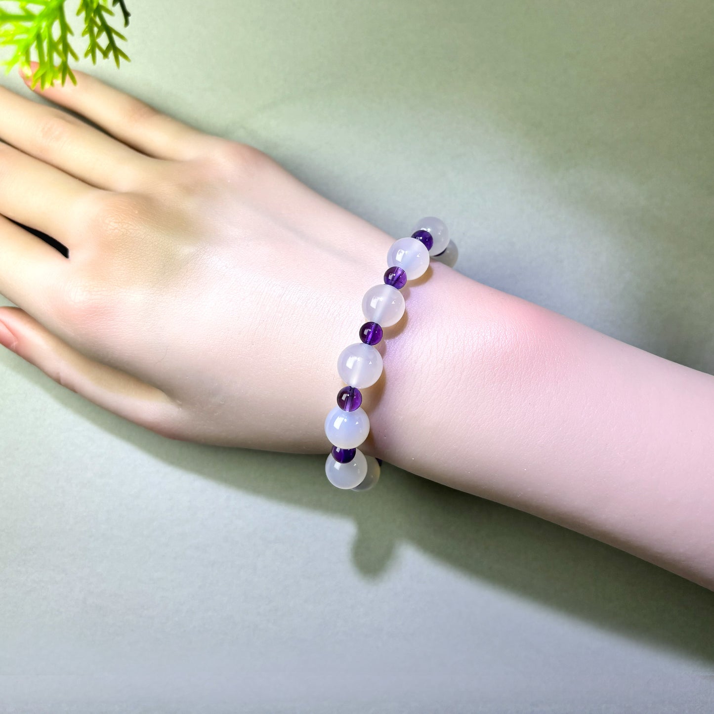 White Agate and Amethyst bracelet worn on wrist for clearer expression and control under pressure