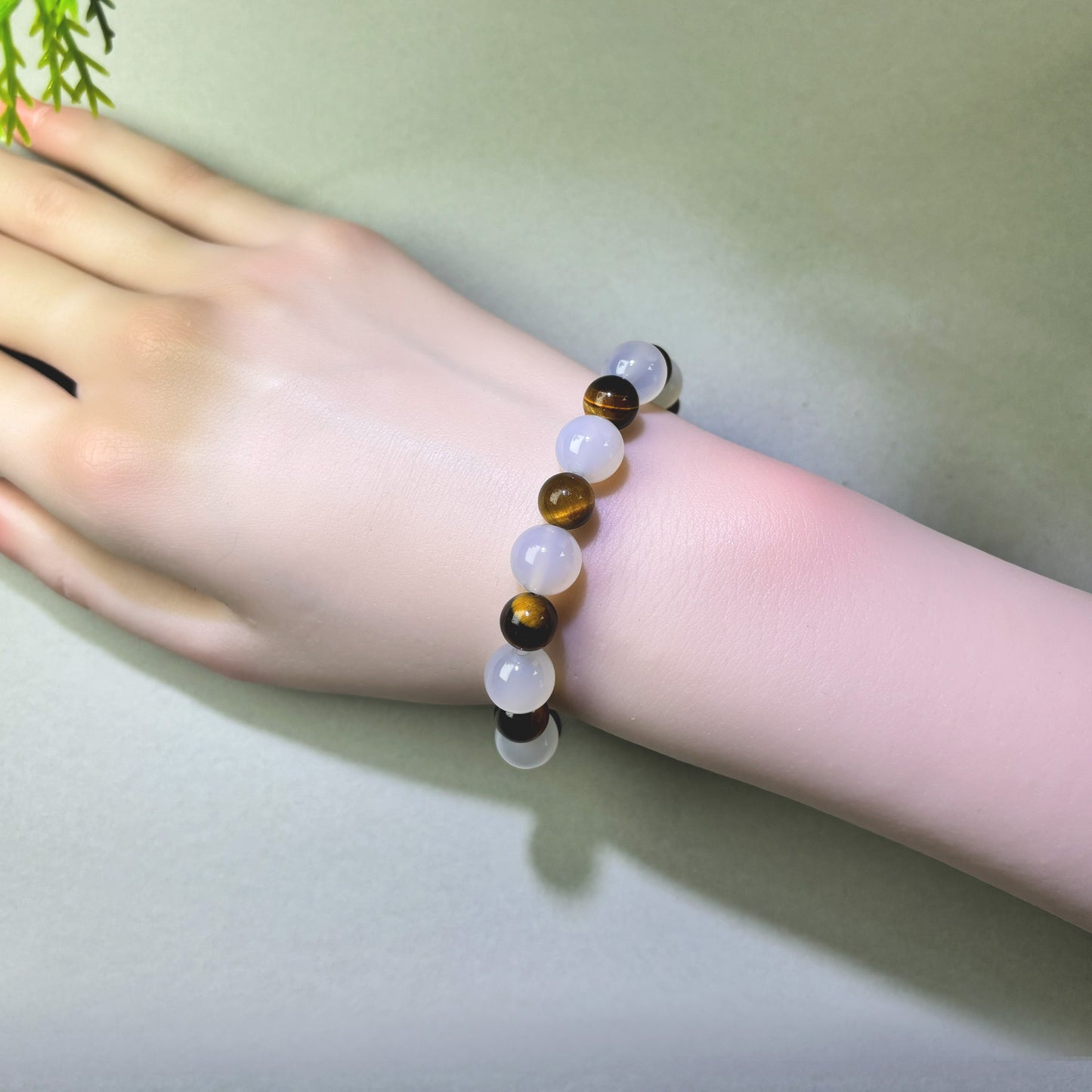 White Agate and Tiger’s Eye bracelet worn on wrist for reducing mental load and stepping away