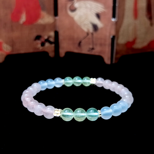 Heart of Soft Light bracelet in a minimalist scene ¨C Fire element crystal for Love & Connection.
