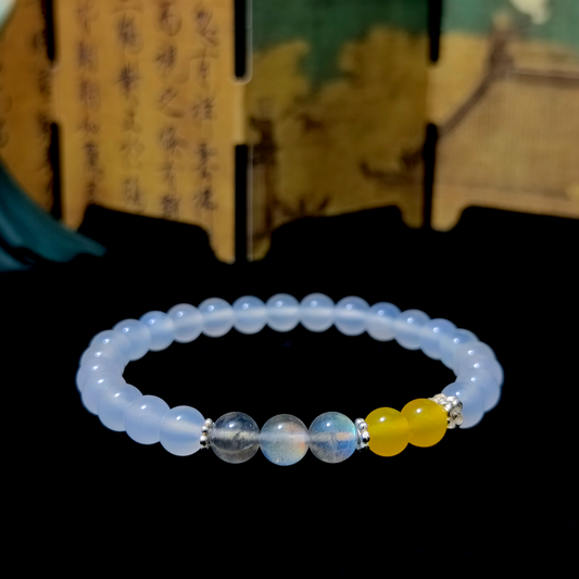 Golden Stillness bracelet in a minimalist scene ¨C Metal element crystal for Sleep & Recovery.