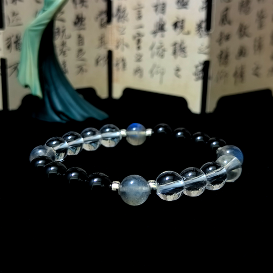 Ember Veil bracelet in a minimalist scene ¨C Water element crystal for Energy Shielding.