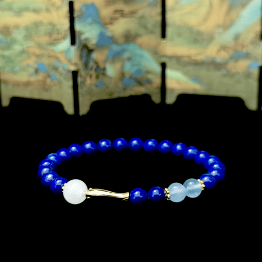 Blue of Becoming bracelet in a minimalist scene ¨C Water element crystal for Self-Worth & Confidence.