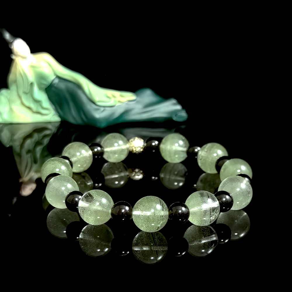 Green Phantom Quartz and Obsidian crystal bracelet for staying consistent, maintaining momentum, and reducing disruption from pressure