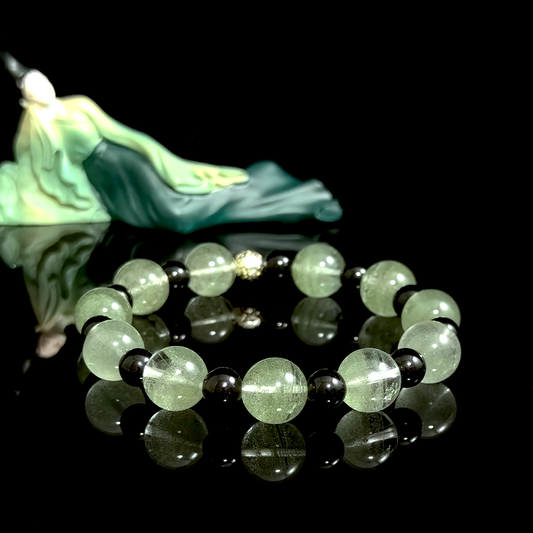 Green Phantom Quartz and Obsidian crystal bracelet for staying consistent, maintaining momentum, and reducing disruption from pressure