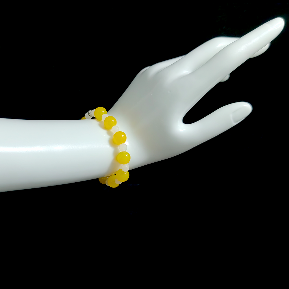 Yellow Agate and White Hetian Jade bracelet worn on hand for stabilizing fear-based anxiety, grounding the body, and restoring a sense of safety – JING Balance