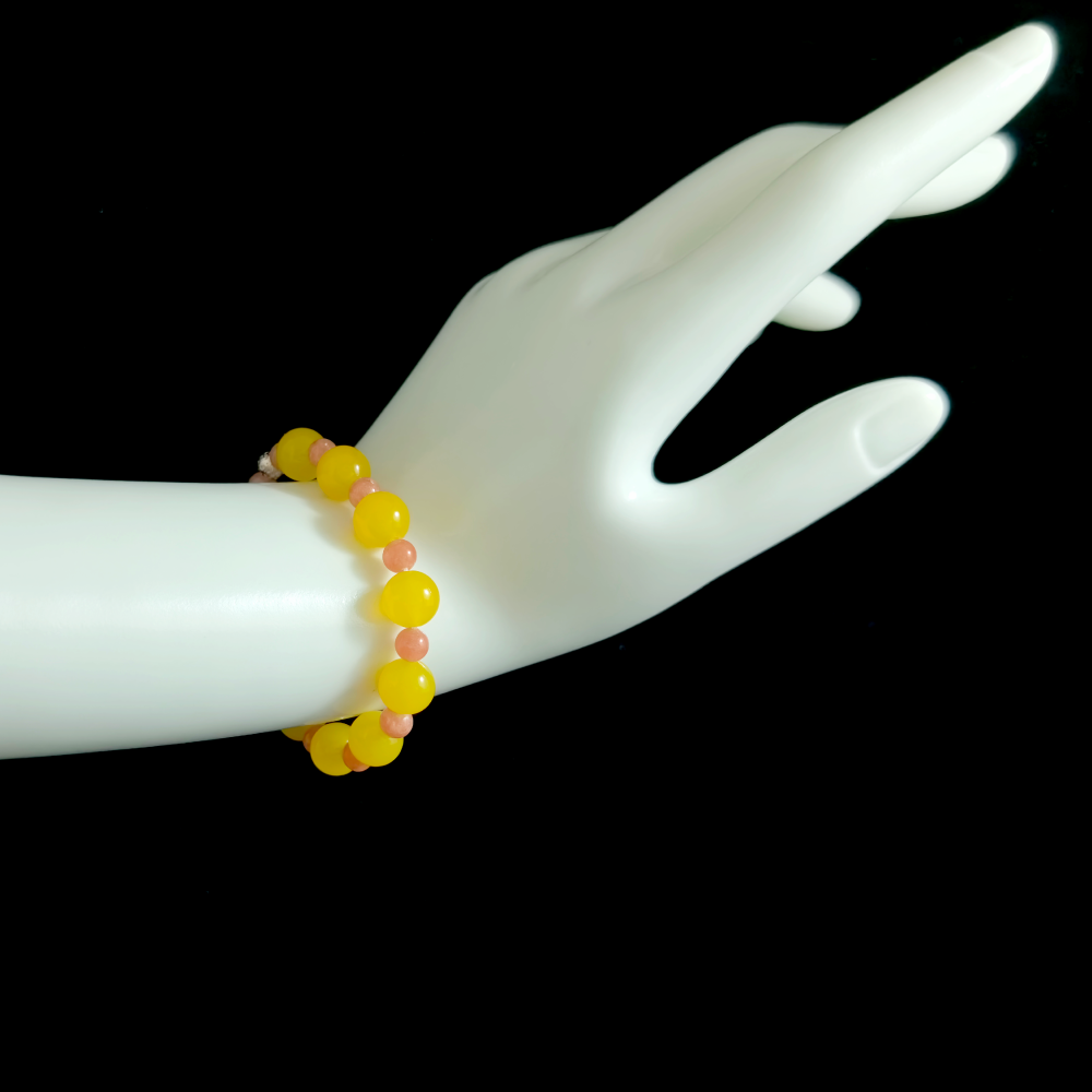 Yellow Agate and Rhodochrosite bracelet worn on hand showing emotional openness and gentle reconnection