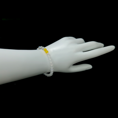 Golden Stillness bracelet worn on wrist ¨C handcrafted Feng Shui jewelry for Sleep & Recovery.