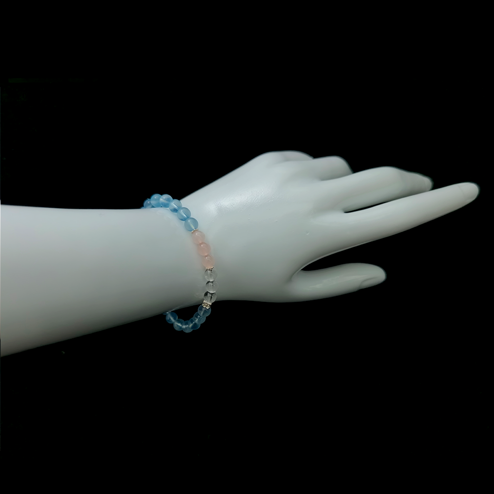 Tides of Tenderness bracelet worn on wrist ¨C handcrafted Feng Shui jewelry for Love & Connection.