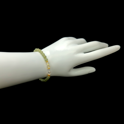 Rooted Prosperity bracelet worn on wrist ¨C handcrafted Feng Shui jewelry for Career & Abundance.