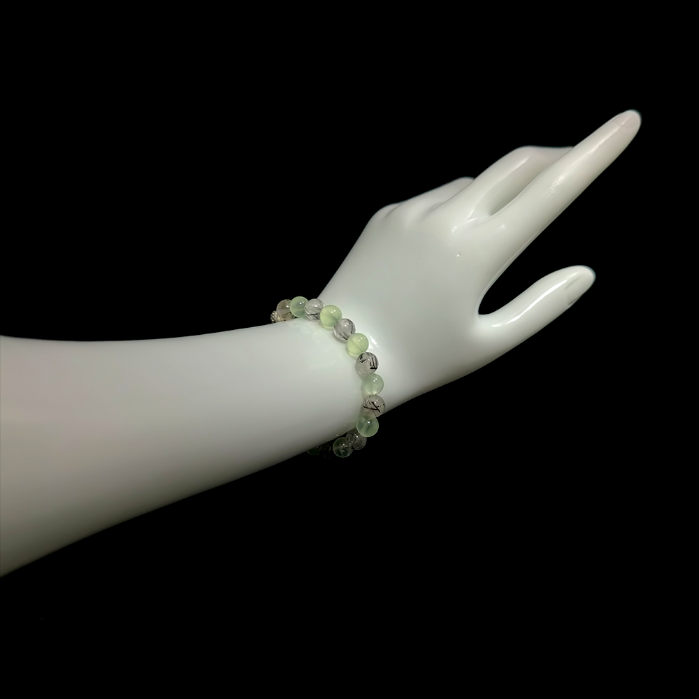 Prehnite and Black Rutilated Quartz bracelet worn on hand showing courage and motivation to take action