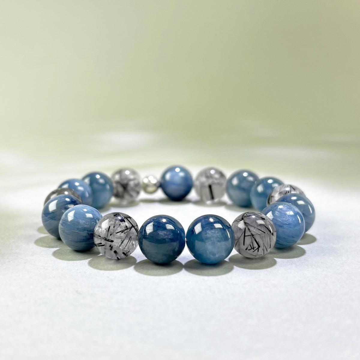 Blue Kyanite and Black Rutilated Quartz crystal bracelet for speaking up and holding your position under pressure