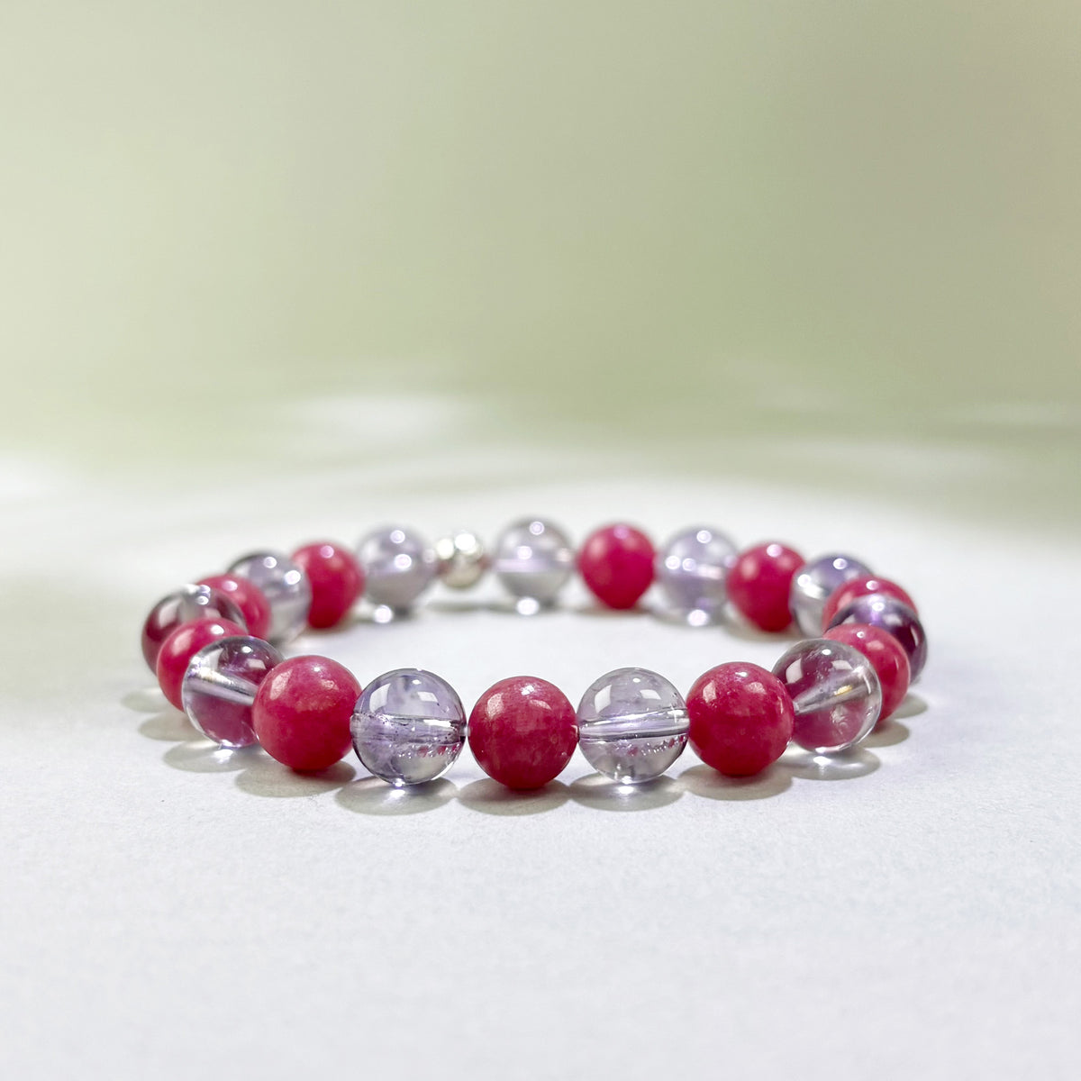 Amethyst and Rhodonite crystal bracelet for replaying a past relationship, lingering hurt, and self-blame