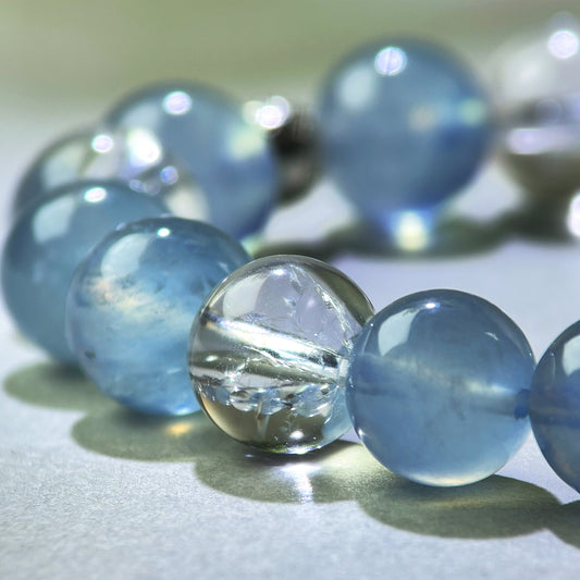 Close-up of Aquamarine and Himalayan Clear Quartz beads in a crystal bracelet for focused communication and organized explanations