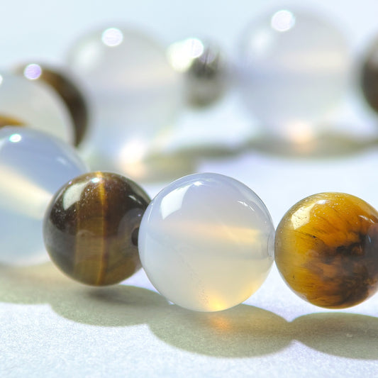 Close-up of White Agate and Tiger’s Eye beads in a crystal bracelet for clear responsibility boundaries