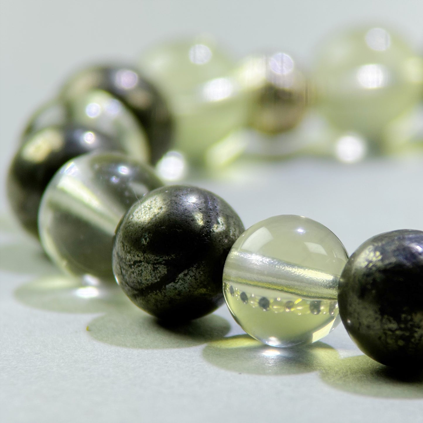 Close-up of Citrine and Pyrite beads in a crystal bracelet for money confidence and practical action