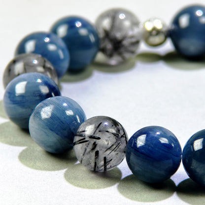 Close-up of Blue Kyanite and Black Rutilated Quartz beads for expression and filtering outside pressure