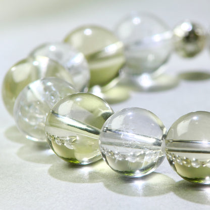 Close-up of Citrine and Himalayan Clear Quartz beads in a crystal bracelet for clearer access to thoughts