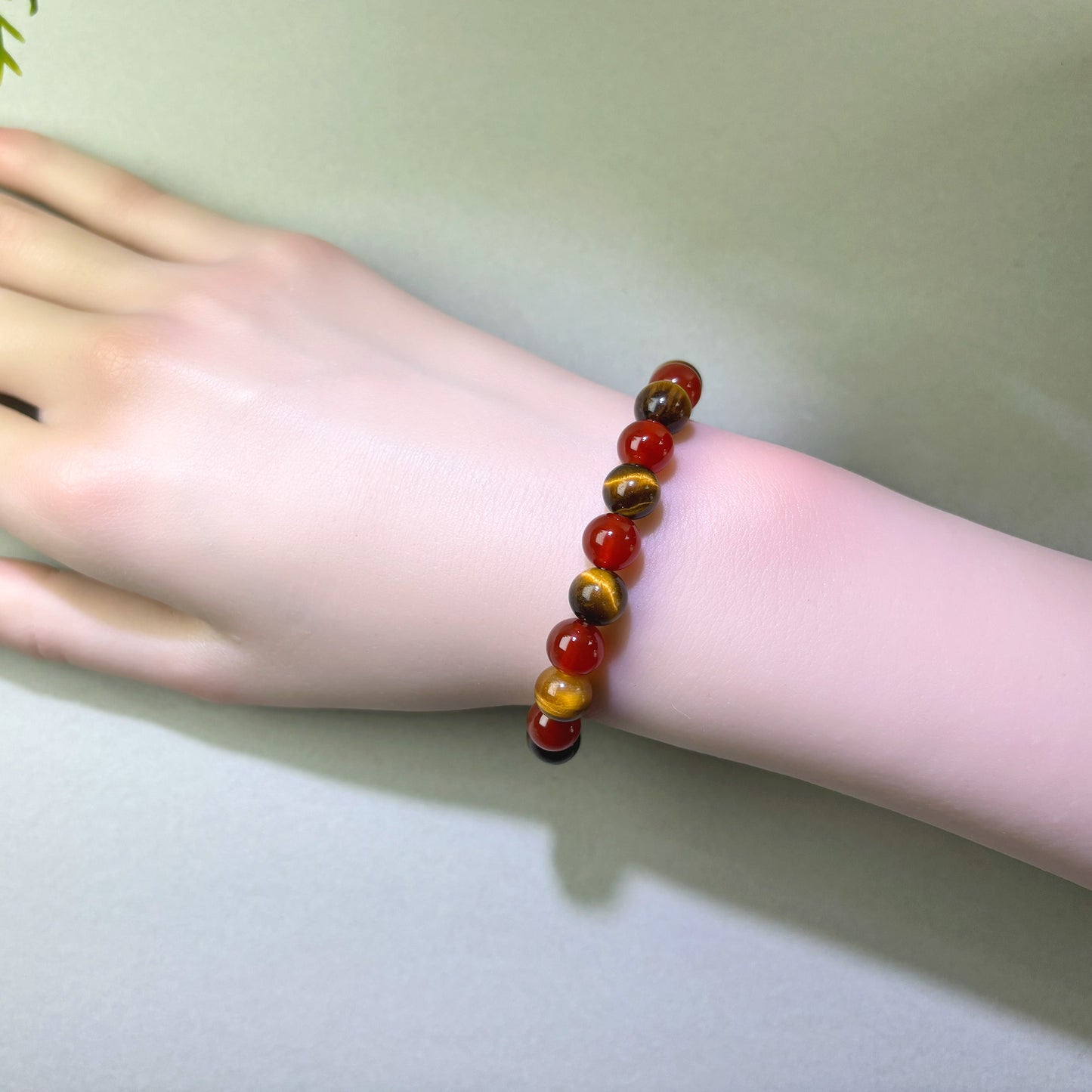 Red Agate and Tiger’s Eye bracelet worn on wrist for steadier focus and follow-through