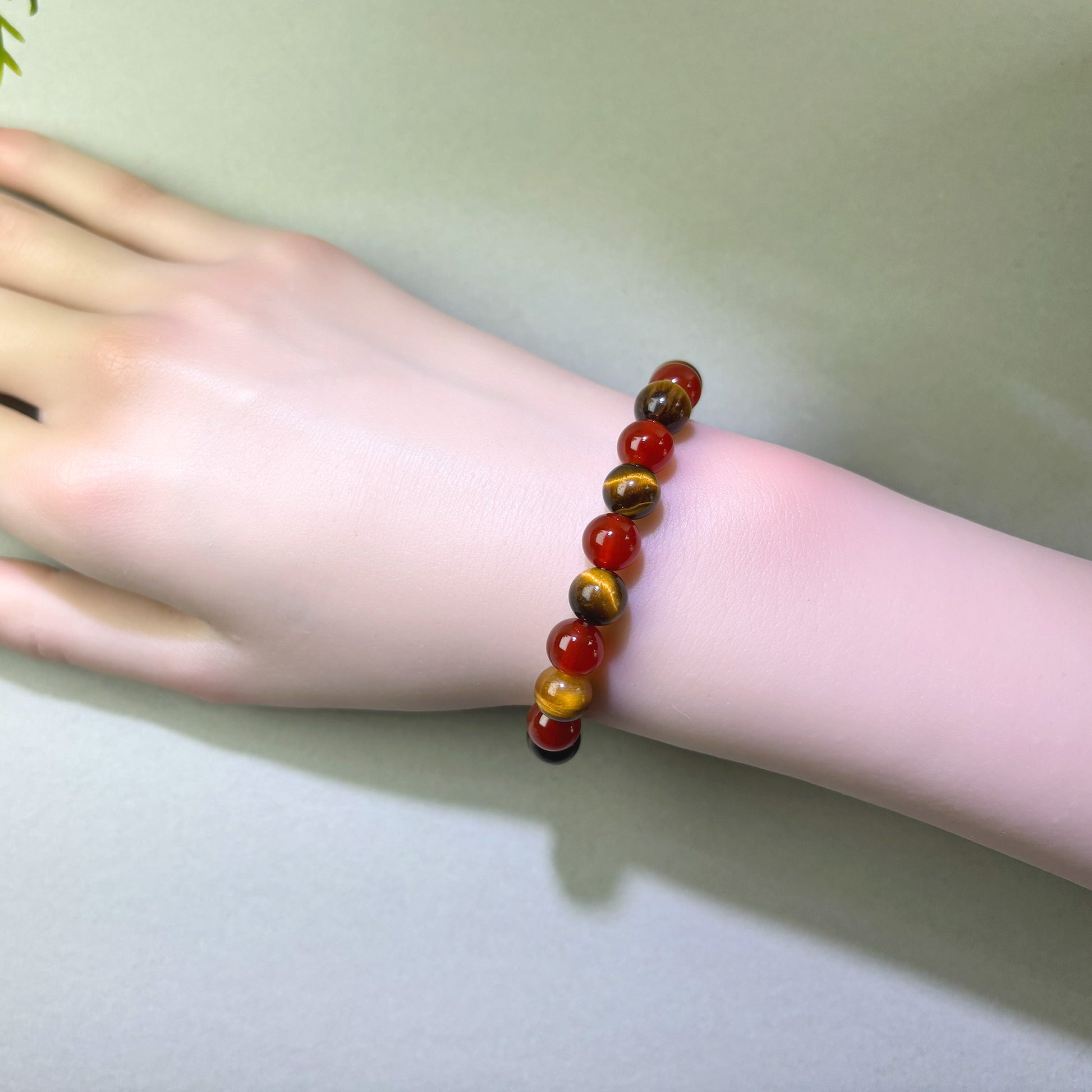 Red Agate and Tiger’s Eye bracelet worn on wrist for steadier focus and follow-through
