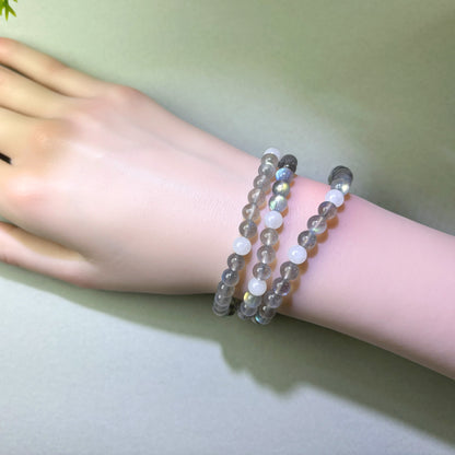 Gray Moonstone and White Hetian Jade bracelet worn on wrist for relaxing into rest more naturally