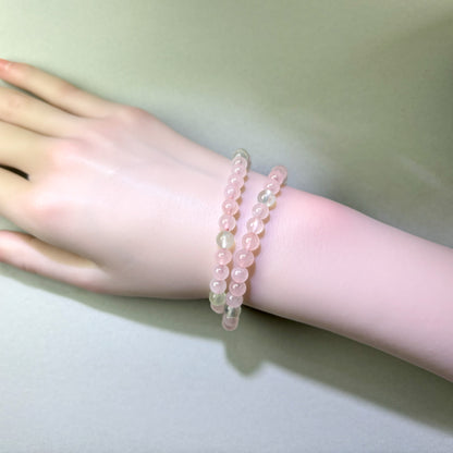 Rose Quartz and Prehnite bracelet worn on wrist for easier connection and bringing fresh energy into relationships