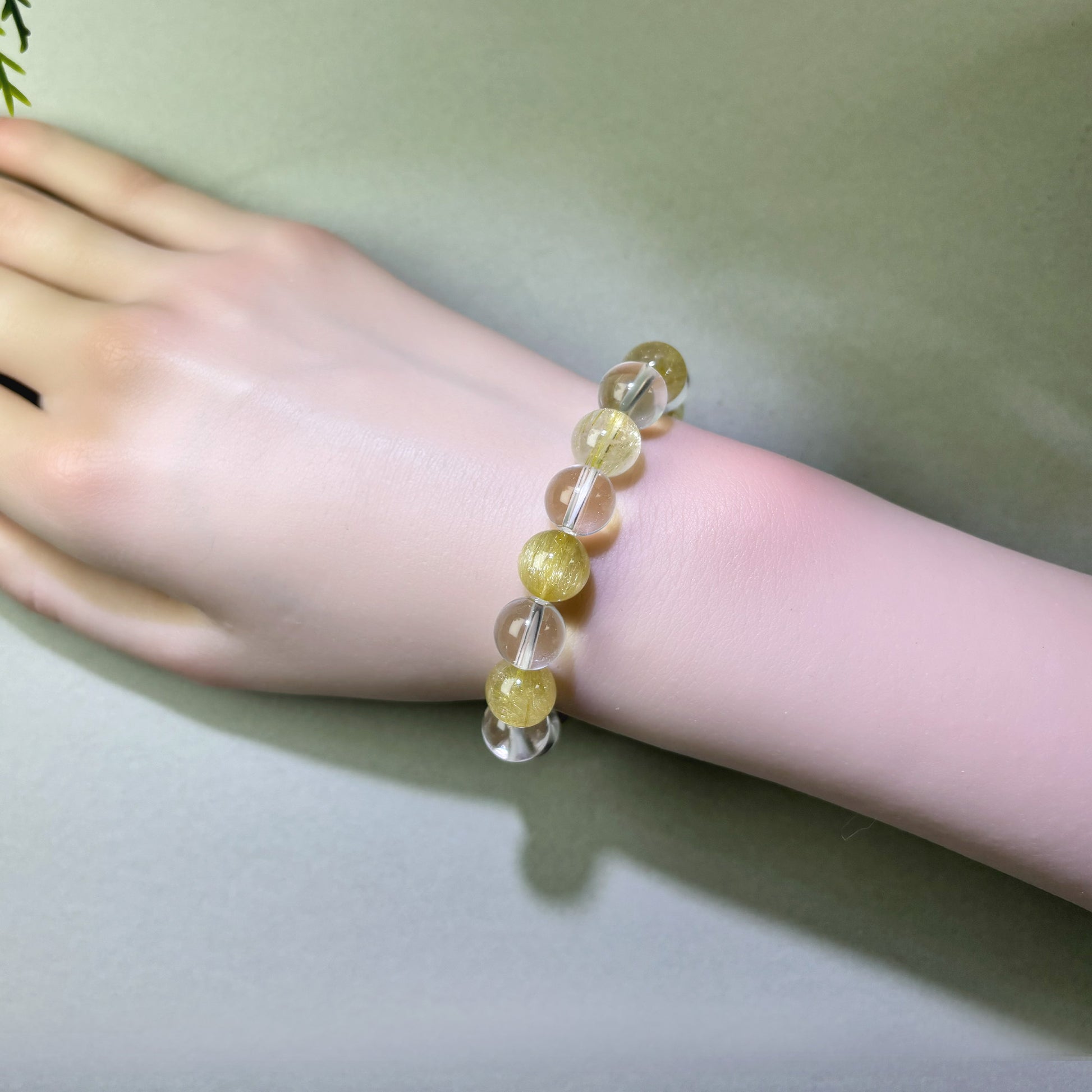 Golden Rutilated Quartz and Clear Quartz bracelet worn on wrist for clearer structure and getting to the point