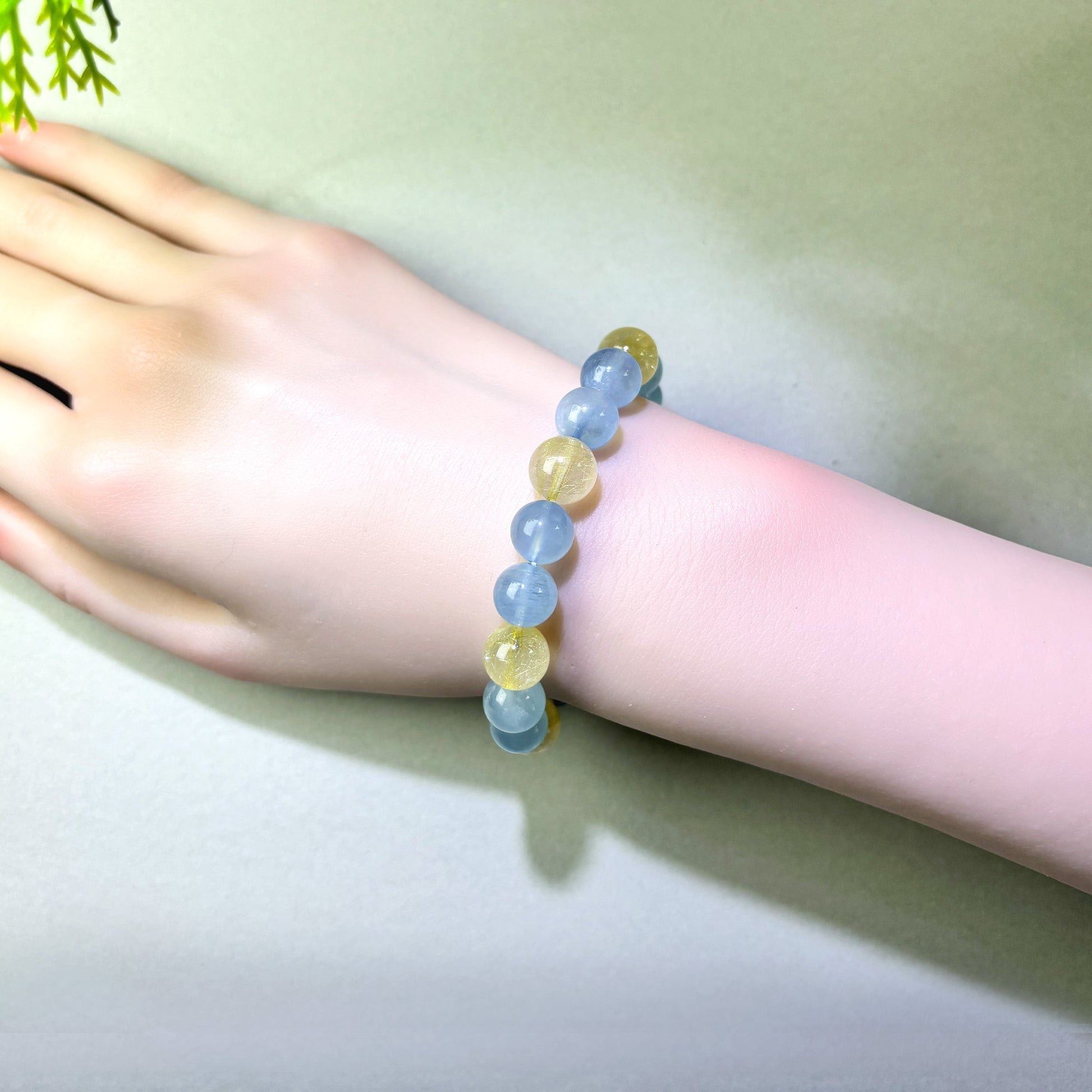 Aquamarine and Golden Rutilated Quartz bracelet worn on wrist for clearer expression in important conversations