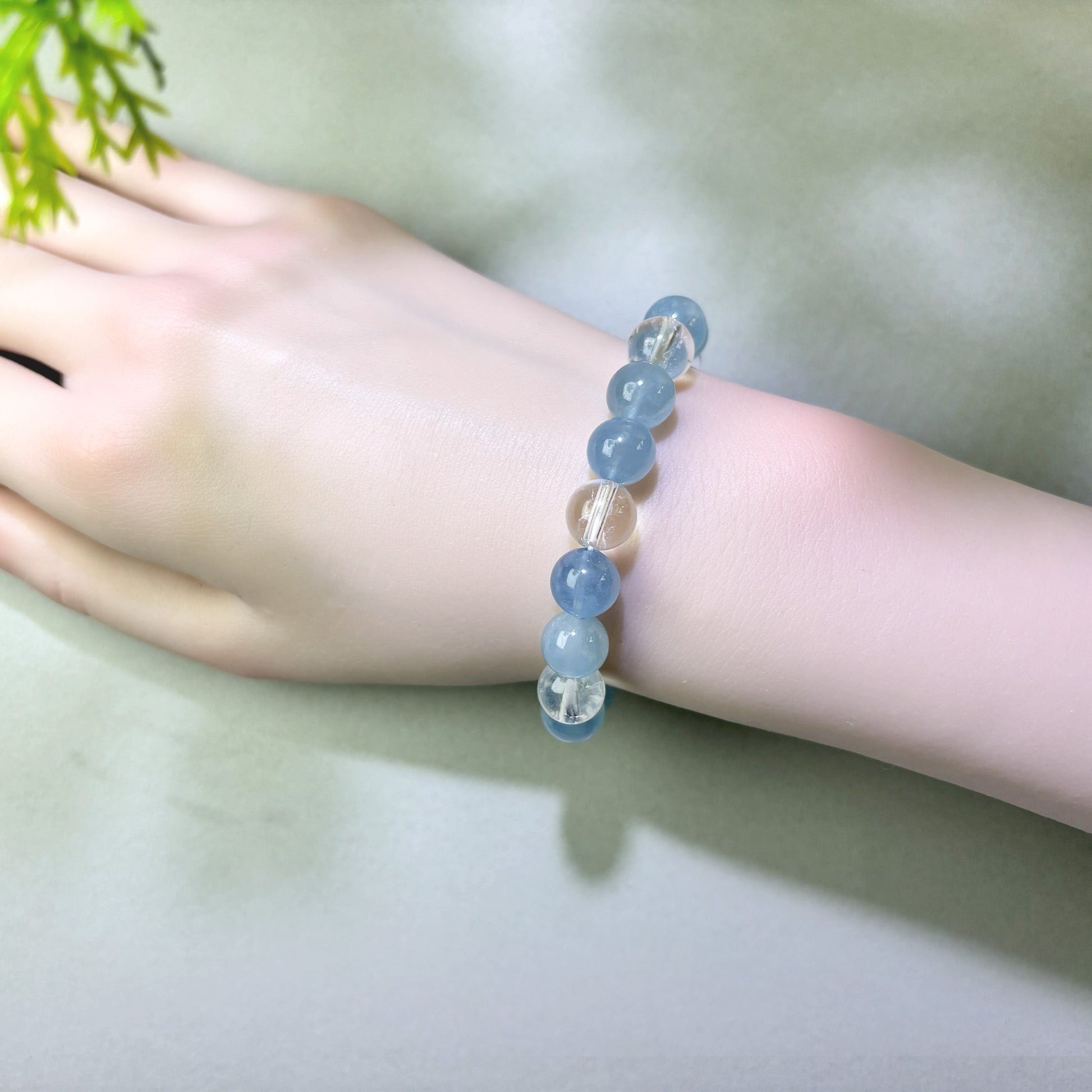 Aquamarine and Himalayan Clear Quartz bracelet worn on wrist for conversations that are easier for others to follow