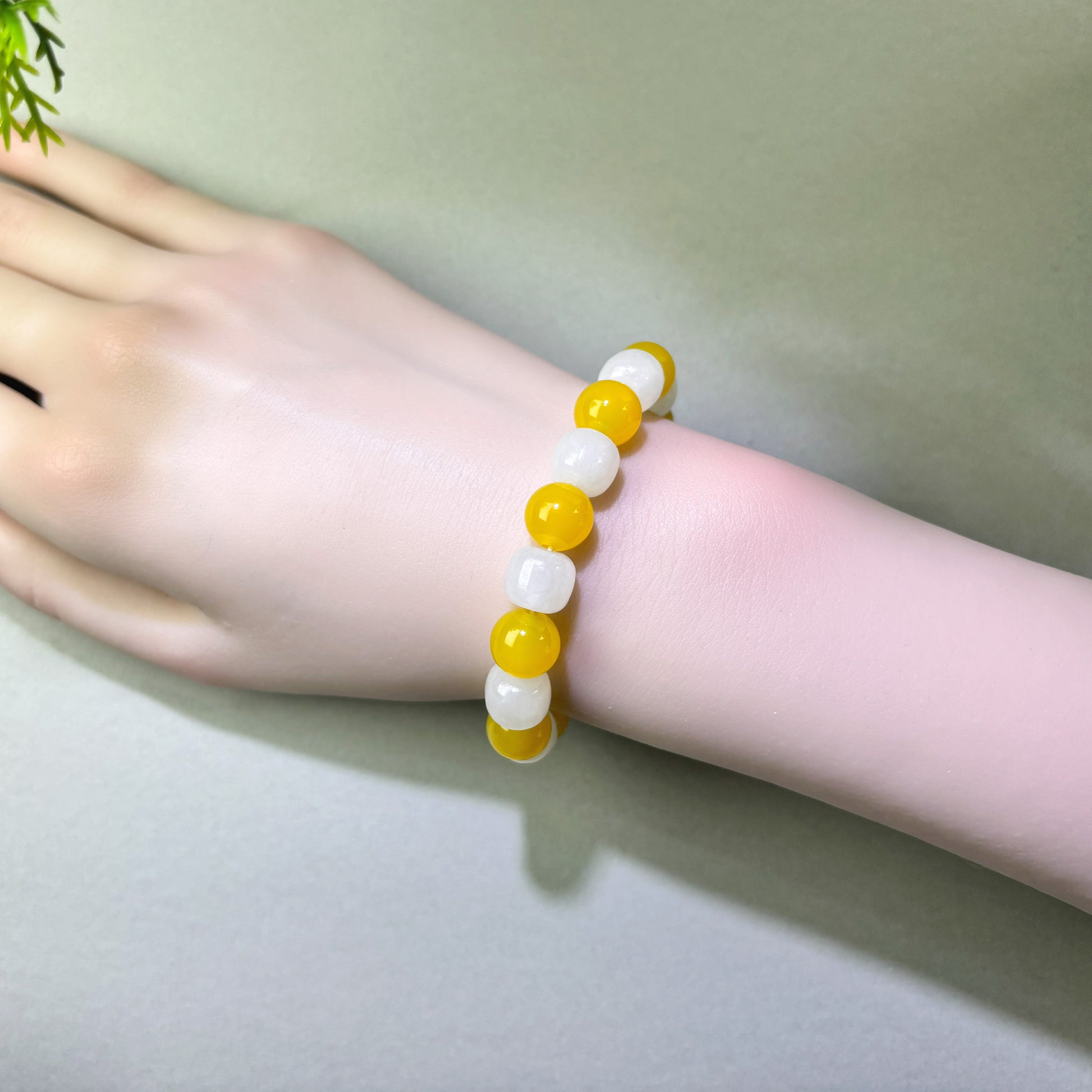 Yellow Agate and White Hetian Jade bracelet worn on wrist for more natural and meaningful conversations