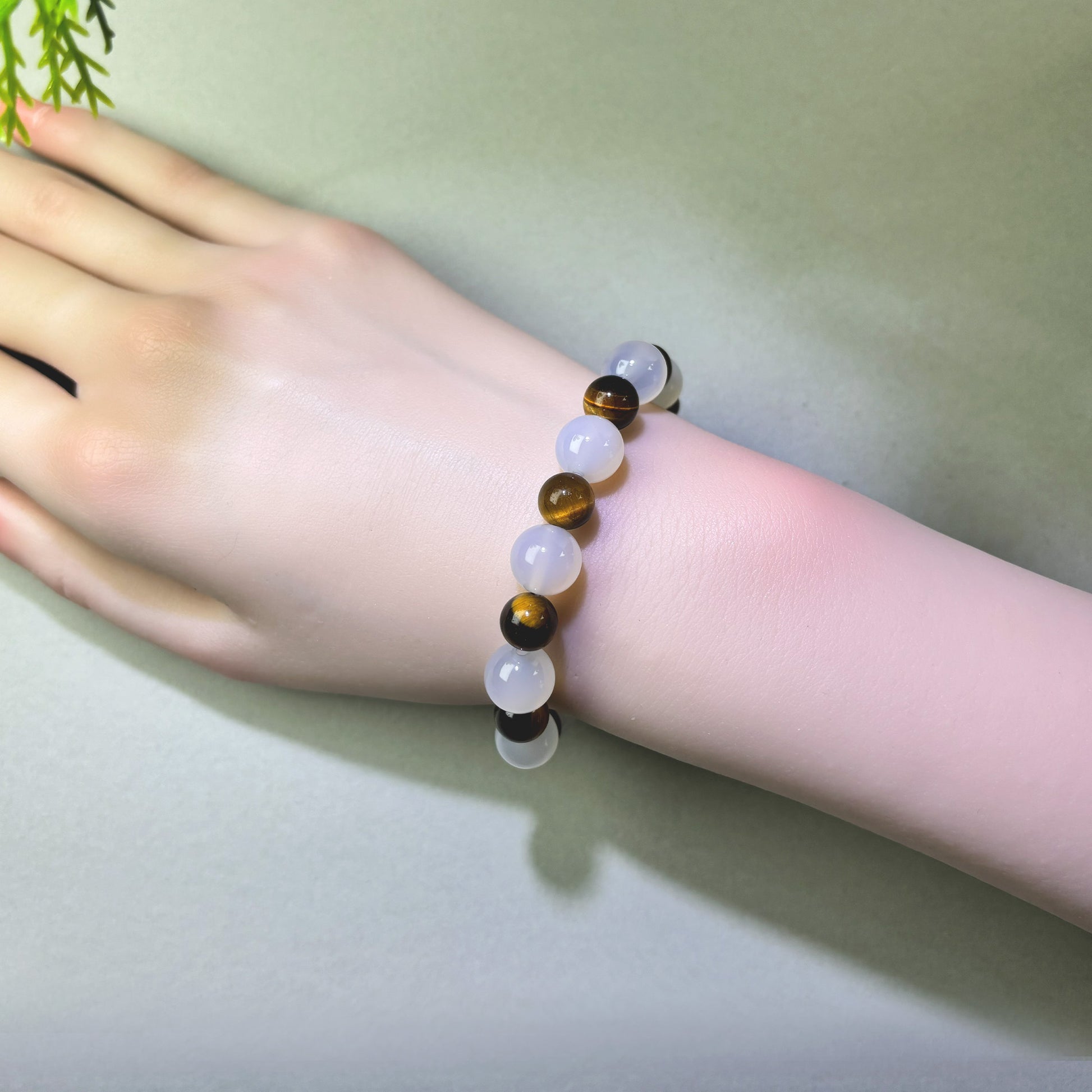 White Agate and Tiger’s Eye bracelet worn on wrist for reducing mental load and stepping away