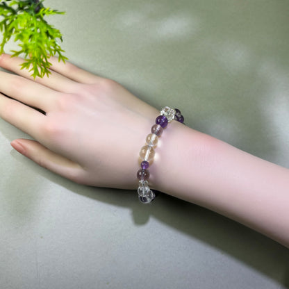 Amethyst and Clear Quartz bracelet worn on wrist for calmer thinking and clearer focus after a busy day