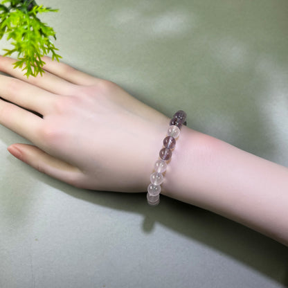 Rose Quartz and Amethyst bracelet worn on wrist for calming post-conflict thoughts and restoring emotional warmth