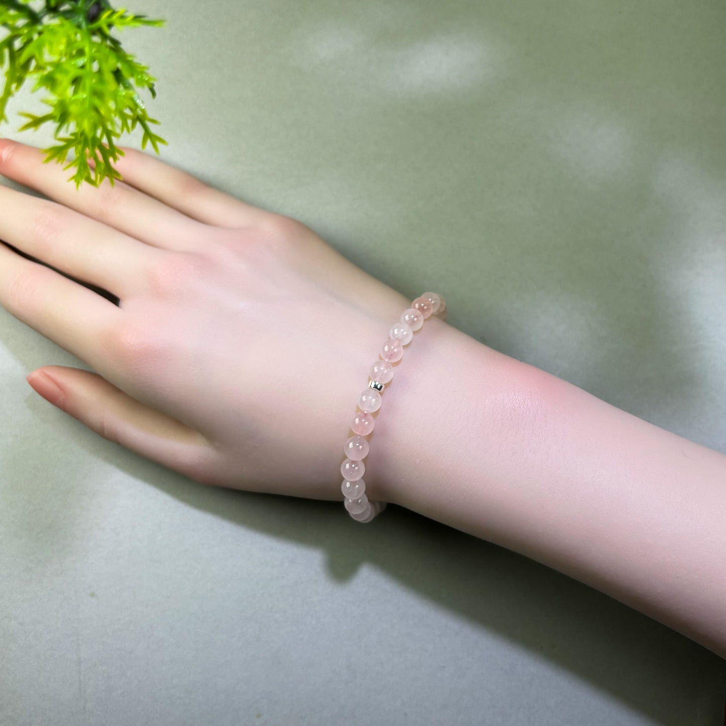 Rose Quartz bracelet worn on wrist for receiving affection and feeling more open to love