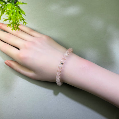 Rose Quartz bracelet worn on wrist for receiving affection and feeling more open to love
