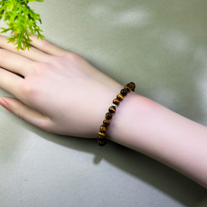 Tiger’s Eye bracelet worn on wrist for grounded focus, inner stability, and consistent progress