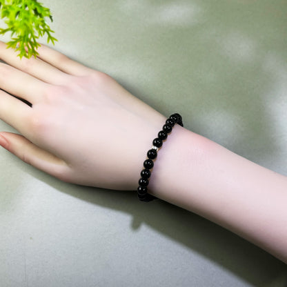 Black Tourmaline bracelet worn on wrist for daily protection and stronger boundaries around outside pressure